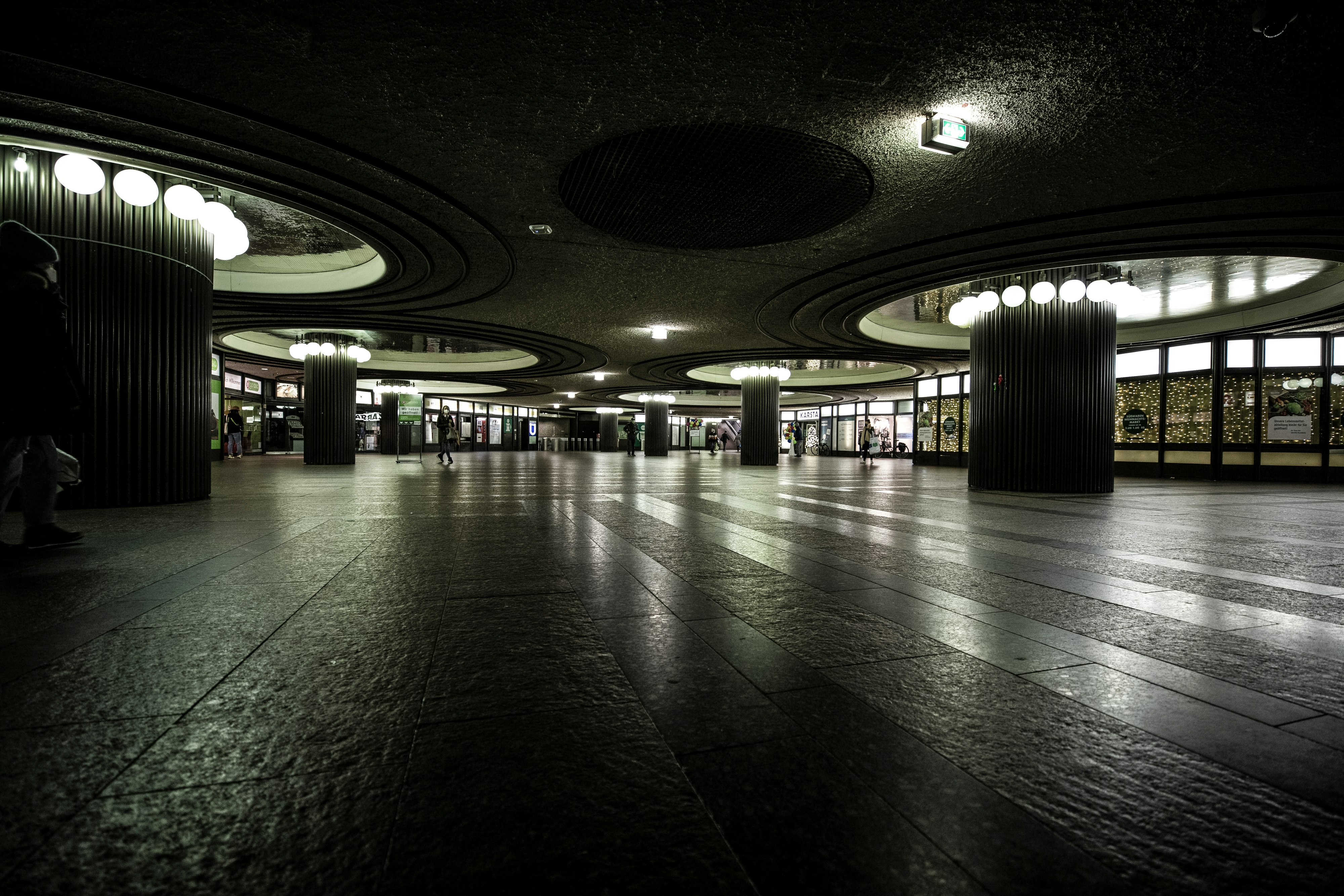 people walking on gray concrete floor